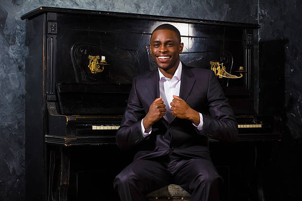 istock Black man near the piano 461091405