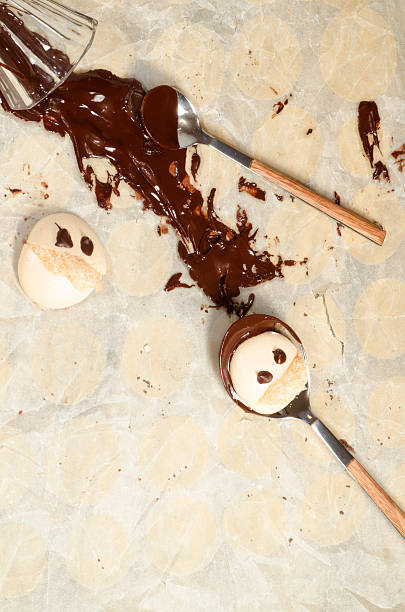 istock Funny meringue with chocolate on baking paper 461092179