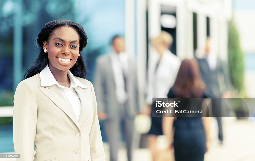 Business people outside office building Diverse business people outside their office building. 30-39 Years Stock Photo