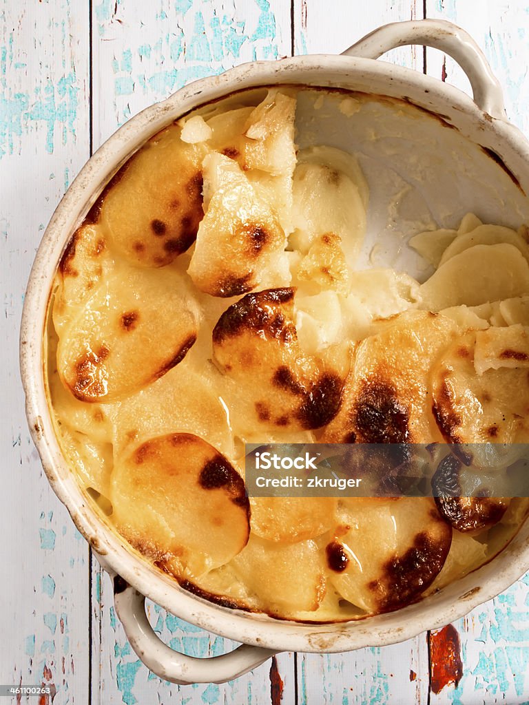 scalloped potatoes close up of a bowl of rustic potato gratin Baked Stock Photo