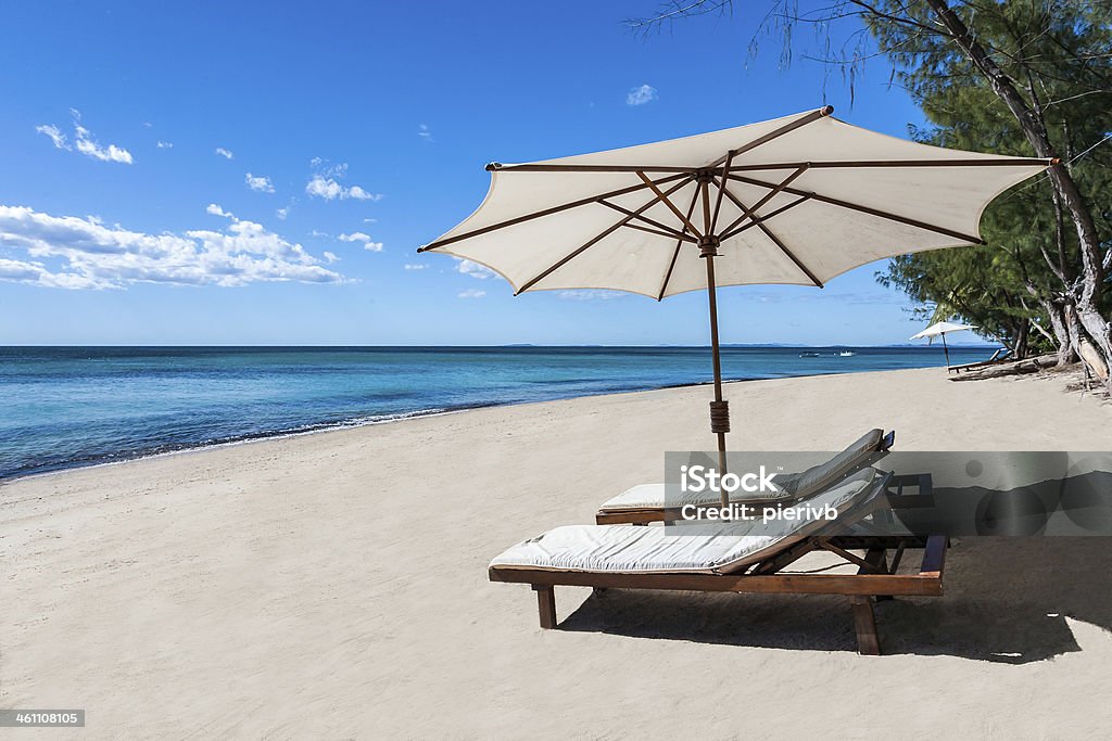 Sunbed on the beach Sunbed and umbrella on a beautiful tropical beach Beach Stock Photo