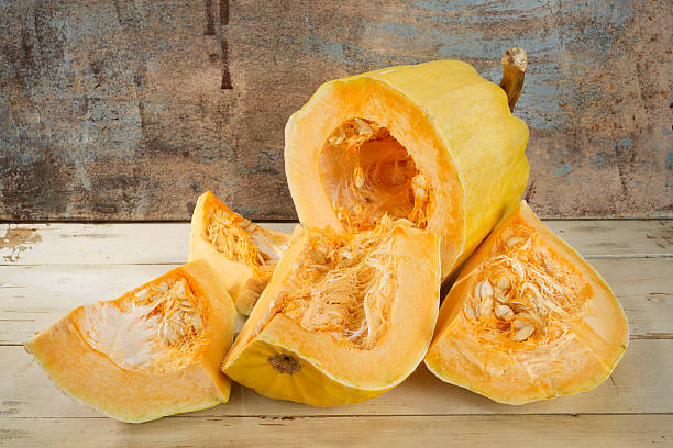 istock Fresh sliced pumpkin on wooden table 461113949