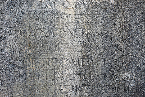 istock Ancient Greek writings etched in stone 461115981
