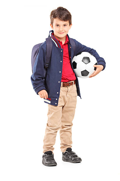 istock Schoolboy holding a soccer ball 461118885