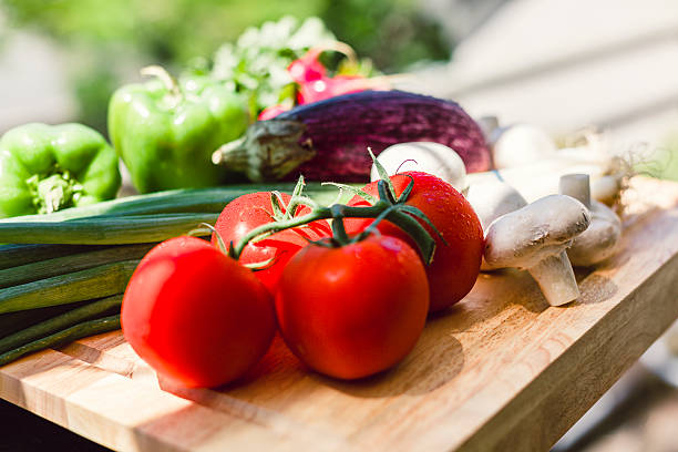 istock Fresh vegetables on wooden chopping board 461122139