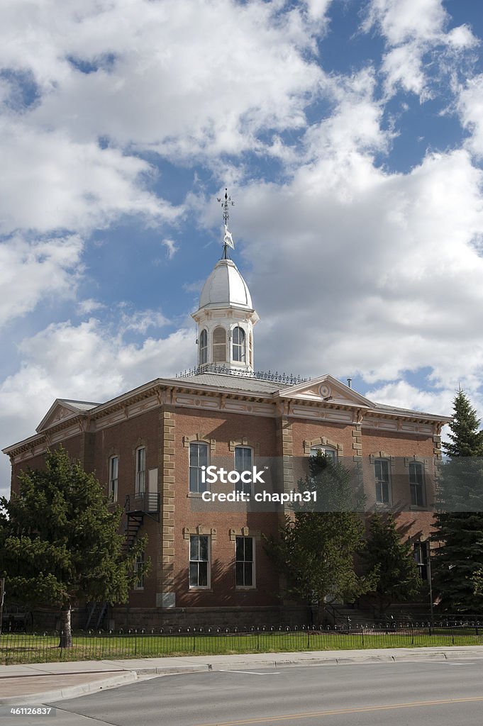 Small Town Main Street with Courthouse A nondescript small town main street with a 18th century courthouse, complete with cupola and weather vane.  There is plenty of copy space available. 18th Century Style Stock Photo