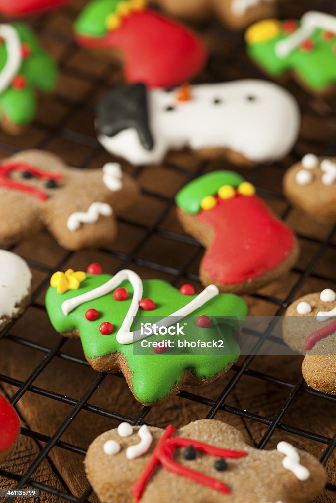 Traditional Iced Gingerbread Christmas Cookies Traditional Iced Gingerbread Christmas Cookies with Trees and Snowmen Baked Stock Photo