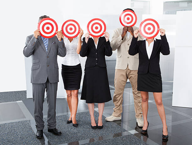 istock Businesspeople Holding Dartboard 461150759
