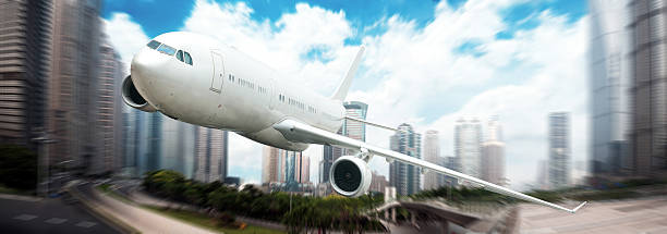 istock airplane away from the city 461152753