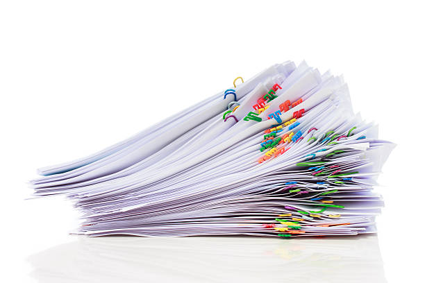 istock Pile of paper with colorful clips 461156047