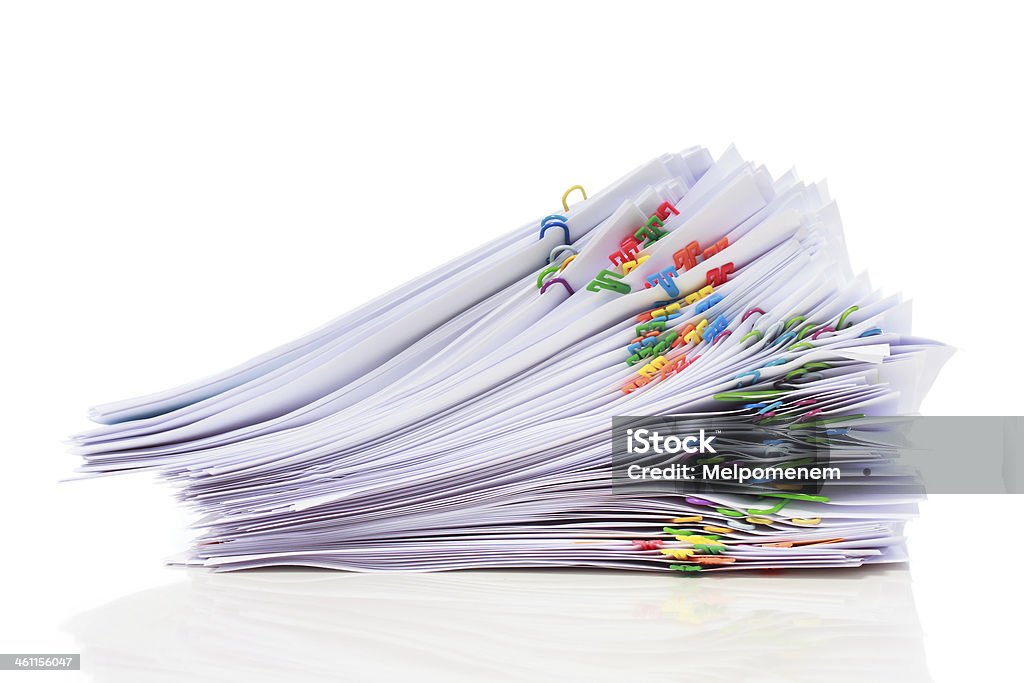 Pile of paper with colorful clips Stack of documents with colorful clips isolated on white background Blank Stock Photo