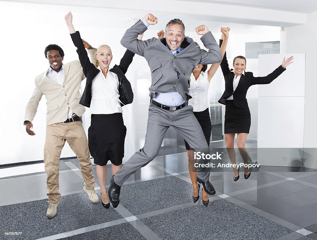 Happy Multiracial Businesspeople Group Of Multiracial Businesspeople Enjoying Their Success Jumping Stock Photo