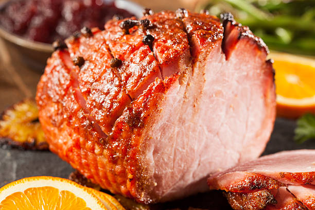 istock Orange honey glazed ham with orange slices 461158571
