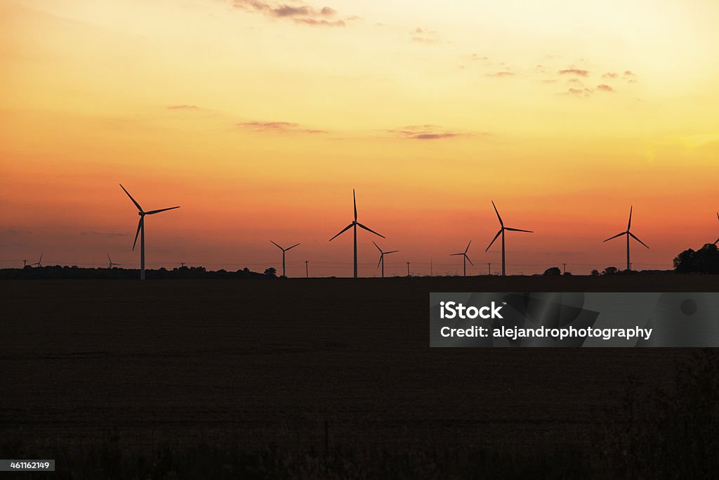 wind turbines Wind turbines generating power in the fields of Indiana during sunset. Agricultural Field Stock Photo