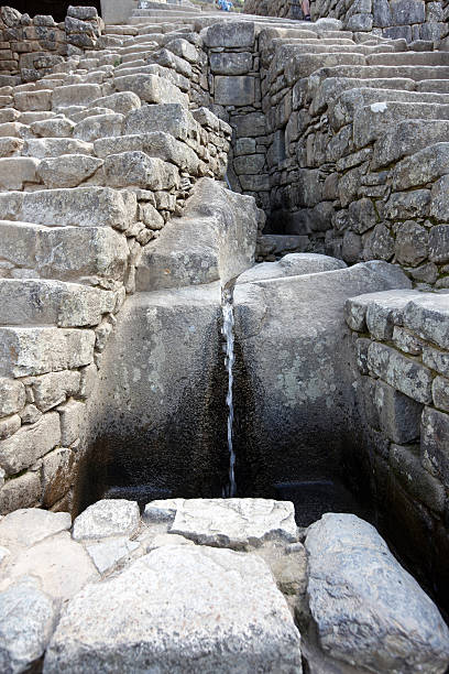 View of stone aqueduct in Macchu Picchu
