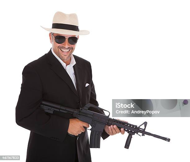 Mature Businessman Holding Gun Stock Photo - Download Image Now - Adult, Adults Only, Authority