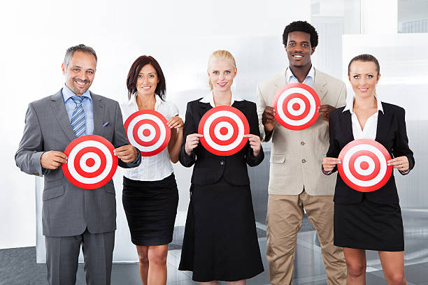 istock Businesspeople Holding Dartboard 461171401