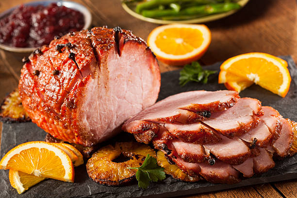 Traditional Sliced Honey Glazed Ham Traditional Sliced Honey Glazed Ham Ready for the Holidays main course stock pictures, royalty-free photos & images