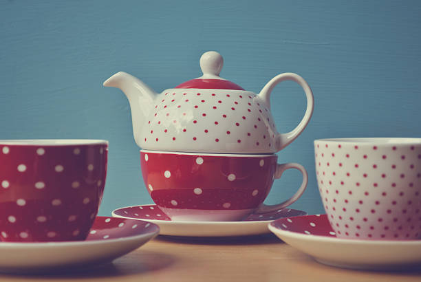 istock Red polka dots kettle with two cup of tea retro 461175769
