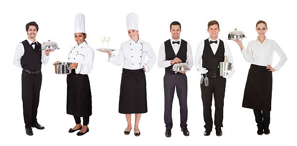 Group Of Waiter And Waitress Young Group Of Waiters And Waitress Over White Background domestic staff stock pictures, royalty-free photos & images