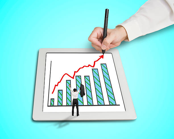 istock Hand drawing growth arrow, chart on tablet  with cheered businessman 461186983