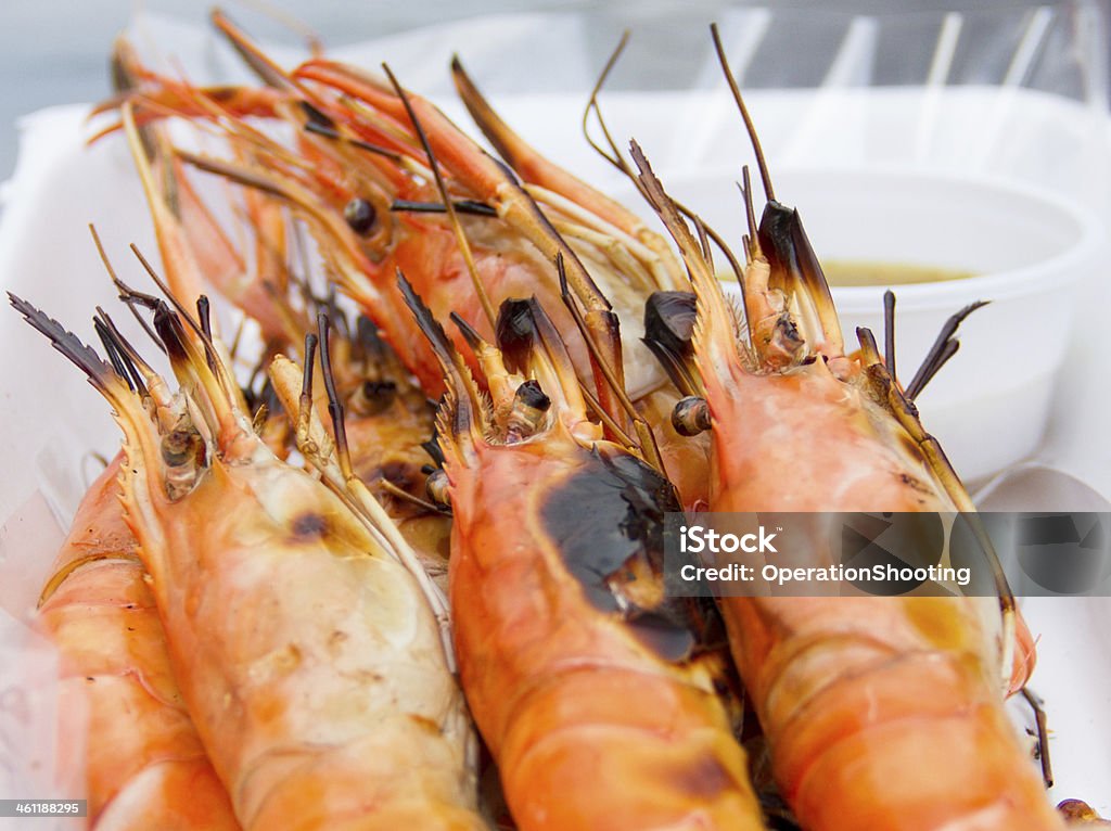 Grilled shrimp and seafood sauce Grilled shrimp and seafood sauce in a white box Appetizer Stock Photo