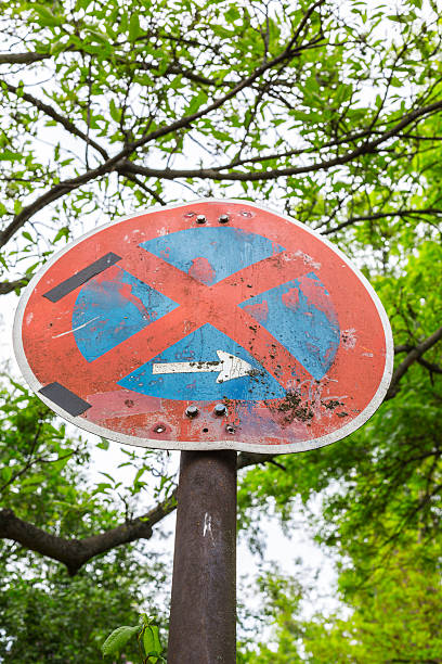 istock old german no parking traffic sign with trees in background 461188597