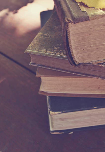 istock Vintage old books in wooden background 461188955