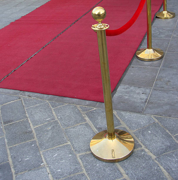 istock red carpet theme with golden bars and cord 461190229