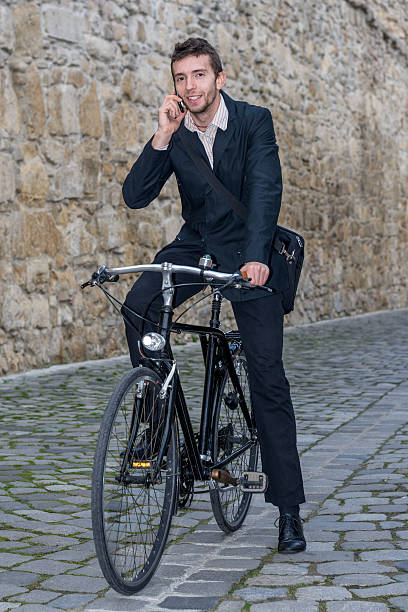 istock young casual business man on his bicycle 461191345
