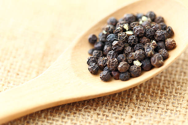 istock pepper in wooden spoon 461192581