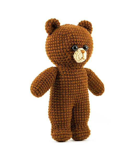 istock handmade crochet brown bear doll on white background, turn right 461198377
