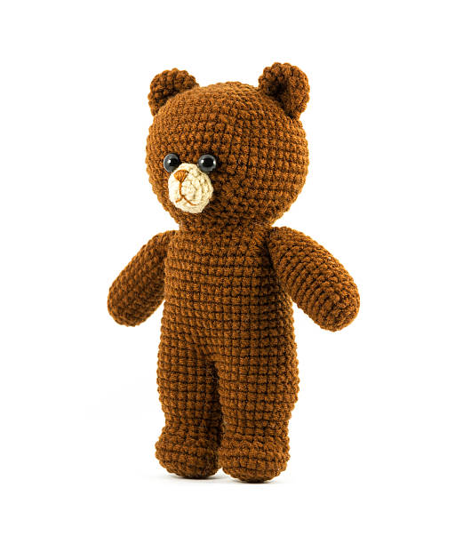 istock handmade crochet brown bear doll on white background, turn left 461198427
