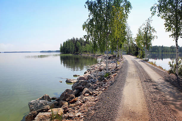 Island onLake Saimaa Lake Saimaa (Finland) in summer. Water on both sides of the lake. saimaa stock pictures, royalty-free photos & images