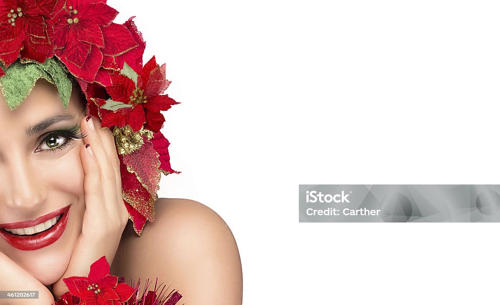 Joyful Christmas Girl with Beautiful Floral Wig. Holiday Hairstyle Cheerful party girl with makeup, manicure and floral hairstyle isolated on white background. Close up of half face. Adult Stock Photo