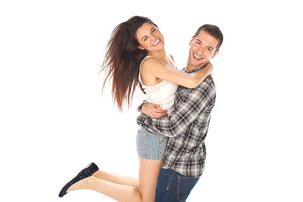istock Happy young couple in casual clothes jumping 461210977