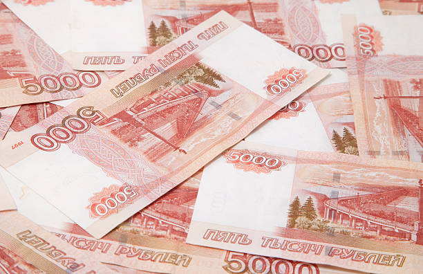 istock Background of one and five thousand russian roubles bills 461213159
