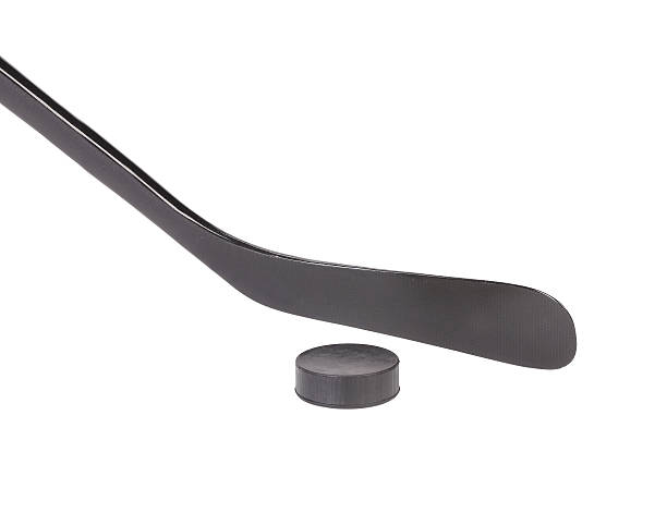 istock Black ice hockey stick and puck. 461214217