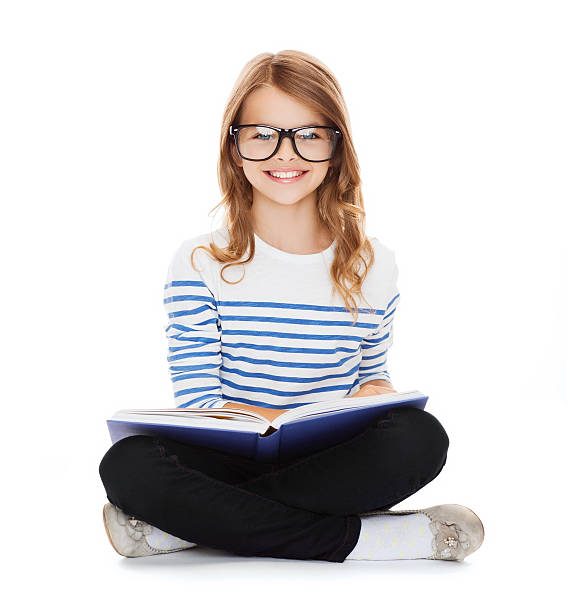 istock smiling little student girl sitting on the floor 461214687