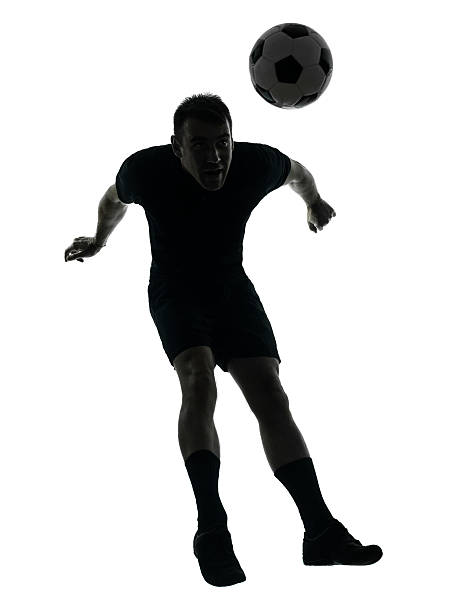 istock man soccer player heading silhouette 461215767