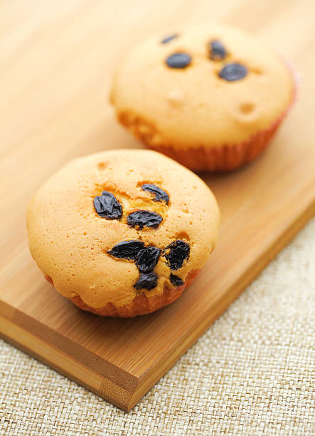 istock Small cupcake on wooden plate 461221461