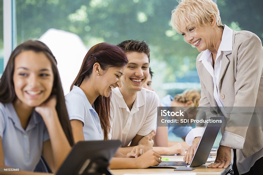 Students in private high school using technology during class Education Stock Photo