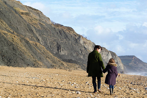 istock Mother and child walking 461224617