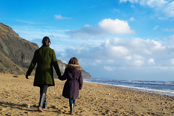 istock Mother and child walking 461224667