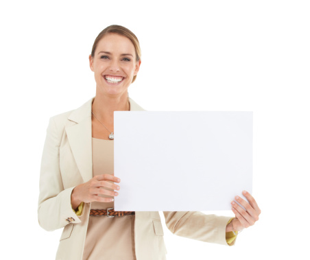 A beautiful businesswoman holding a blank placard