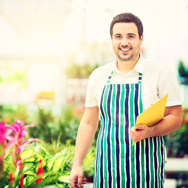 istock Male Florist Working At Garden Center. 461227135