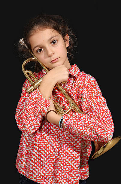 istock Young girl with a trumpet 461233801