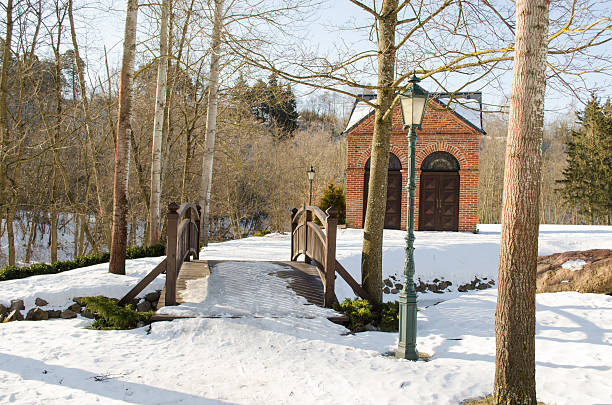 istock park bridge brook retro lighting house snow winter 461233835