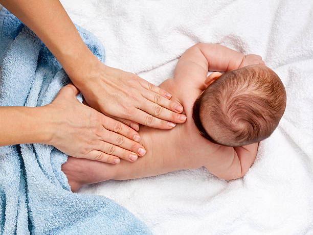 Baby back massage stock photo
