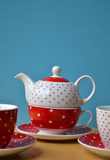 istock Red polka dot kettle and two cup of tea 461234645